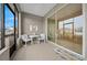 Comfortable screened porch with sliding glass doors leading to the interior at 7932 Sw 89Th Cir, Ocala, FL 34481
