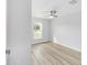Bright bedroom with wood-look flooring and large window at 13573 Sw 115 Pl, Dunnellon, FL 34432