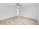 Spacious bedroom with wood-look flooring, a ceiling fan, and ample natural light at 13573 Sw 115 Pl, Dunnellon, FL 34432