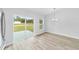 Dining area adjacent to the kitchen with sliding glass doors leading to the backyard at 13573 Sw 115 Pl, Dunnellon, FL 34432