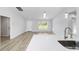 Spacious kitchen with a large island, modern faucet, and ample counter space at 13573 Sw 115 Pl, Dunnellon, FL 34432