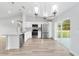 Stylish kitchen with white cabinets, stainless steel appliances, and a view of the backyard at 13573 Sw 115 Pl, Dunnellon, FL 34432