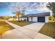 Single story home with a modern exterior and a black garage door at 15077 Sw 37Th Ter, Ocala, FL 34473