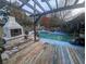 Backyard oasis with a pool, fireplace, and pergola at 18695 Ne 5Th Terrace Rd, Citra, FL 32113