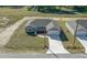 Aerial view of single-story home with attached garage and driveway at 281 Locust Pass, Ocala, FL 34472