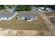 Backyard of a new construction home with covered patio and some grass at 281 Locust Pass, Ocala, FL 34472