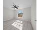 Bright bedroom with large window and wood-look flooring at 281 Locust Pass, Ocala, FL 34472