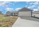 Front exterior view of a single-story house with an attached garage and driveway at 281 Locust Pass, Ocala, FL 34472