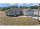 Elevated view of a gray, single-story home with attached garage at 281 Locust Pass, Ocala, FL 34472