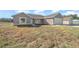 New construction home with attached garage and covered entryway at 281 Locust Pass, Ocala, FL 34472