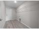 Laundry room with wire shelving and white door at 281 Locust Pass, Ocala, FL 34472