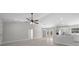 Open concept living area with wood-look flooring and ceiling fan at 281 Locust Pass, Ocala, FL 34472