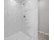 Marble tiled shower with chrome fixtures at 281 Locust Pass, Ocala, FL 34472
