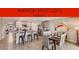 Stylish open plan kitchen with large island, dining area, and stainless steel appliances at 5171 Sw 161St Place Rd, Ocala, FL 34473