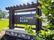 Autumn Glen community entrance with an elegant sign and lush landscaping at 7234 Se 113Th Ln, Belleview, FL 34420