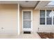 Close-up view of the front door with decorative screen at 8968 Sw 116Th Place Rd, Ocala, FL 34481