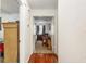 Hallway leading to bedrooms with wood-look flooring and decorative items at 8968 Sw 116Th Place Rd, Ocala, FL 34481