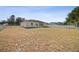 View of the back exterior of the home and the fenced backyard at 9345 Se 162Nd Pl, Summerfield, FL 34491