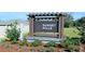 Sunset Hills community entrance sign with landscaping at 9989 Se 161St Lane Rd, Summerfield, FL 34491