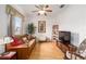 Cozy Gathering room featuring a sleeper sofa and wood floors at 12081 Se 91St Ave, Summerfield, FL 34491