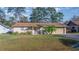 One-story home with attached garage and well-maintained lawn at 17451 Se 18Th St, Silver Springs, FL 34488