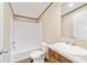 Bathroom features a tub, toilet and vanity with granite top at 18478 Se 58Th Pl, Ocklawaha, FL 32179