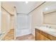 Bathroom features a tub, shower, and vanity with a granite countertop at 18478 Se 58Th Pl, Ocklawaha, FL 32179