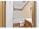 Clean bathroom with tub, toilet, and vanity at 18478 Se 58Th Pl, Ocklawaha, FL 32179