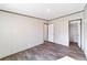 Spacious bedroom with wood-look floors and closet at 18478 Se 58Th Pl, Ocklawaha, FL 32179