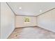 Spacious bedroom with large window and wood flooring at 18478 Se 58Th Pl, Ocklawaha, FL 32179