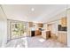 Kitchen with island, wood cabinets, and back door access at 18478 Se 58Th Pl, Ocklawaha, FL 32179