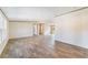Bright living room featuring wood-look floors and an open layout at 18478 Se 58Th Pl, Ocklawaha, FL 32179
