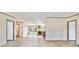 Open concept living room with kitchen and dining views at 18478 Se 58Th Pl, Ocklawaha, FL 32179