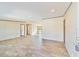 Spacious living room with wood-look flooring and an open floor plan at 18478 Se 58Th Pl, Ocklawaha, FL 32179
