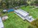 Home, pool, and barn on a large lot with lush landscaping at 3505 Ne 97Th Street Rd, Anthony, FL 32617