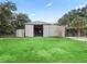 Metal barn with open doors, revealing interior space at 3505 Ne 97Th Street Rd, Anthony, FL 32617