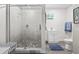Modern bathroom with walk-in shower, pebble floor, and white vanity at 3505 Ne 97Th Street Rd, Anthony, FL 32617