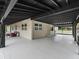 Covered patio area with exterior access to the laundry and additional storage at 3505 Ne 97Th Street Rd, Anthony, FL 32617