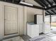 Convenient laundry room with washer and dryer, located near exterior access at 3505 Ne 97Th Street Rd, Anthony, FL 32617