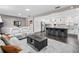 Open concept living room and kitchen with white couches at 3505 Ne 97Th Street Rd, Anthony, FL 32617