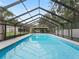 Inviting screened pool area, perfect for relaxation and entertainment at 3505 Ne 97Th Street Rd, Anthony, FL 32617
