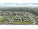 Aerial view of a neighborhood with a house having a backyard, surrounded by greenery at 3810 Se 4Th Ter, Ocala, FL 34480