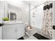 White bathroom with shower/tub combo, vanity, and tiled floor at 3810 Se 4Th Ter, Ocala, FL 34480