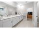 Elegant bathroom with double vanity, large shower, and walk-in closet at 3810 Se 4Th Ter, Ocala, FL 34480