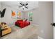 Cozy bedroom featuring a ceiling fan, bright window, and comfortable bed at 3810 Se 4Th Ter, Ocala, FL 34480