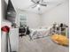 Cozy bedroom with a bed, TV, and plenty of storage at 3810 Se 4Th Ter, Ocala, FL 34480