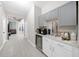 Coffee bar with gray and white cabinets, beverage cooler, and coffee maker at 3810 Se 4Th Ter, Ocala, FL 34480
