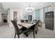 Dining area with a stylish table, black chairs, and modern chandelier at 3810 Se 4Th Ter, Ocala, FL 34480