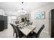 Elegant dining room with a marble table and black chairs at 3810 Se 4Th Ter, Ocala, FL 34480