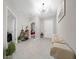 Home entryway with tile floor, bench, and access to adjacent rooms at 3810 Se 4Th Ter, Ocala, FL 34480